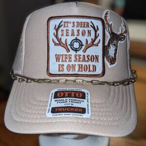 Trucker hat with iron on patches and embellishments